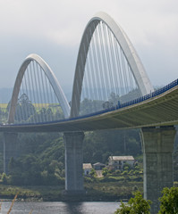 Fototapeta premium The bridge over the River Navia carrying the A-8, Asturias, Spain.