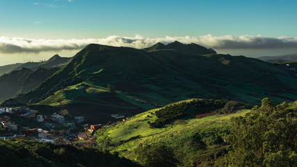 Fototapeta premium Green mountain and blue sky with morning lights