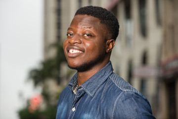 close up of young african man smiling.