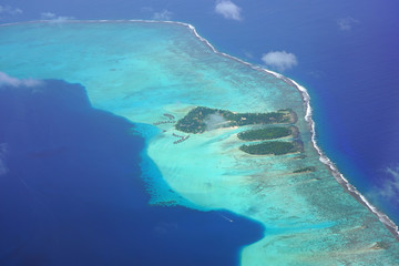 Aerial view of the Taha'a Island Resort and lagoon on Motu Tauta near Tahiti in French Polynesia, South Pacific © eqroy