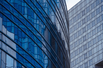 Fototapeta na wymiar Business concept - detail of a corporate building in blue tones