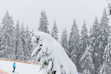 The skier is on slope in Bukovel ski resort, Ukraine