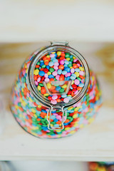 Fototapeta na wymiar candys M & M's dispenser with them, all colours sweet