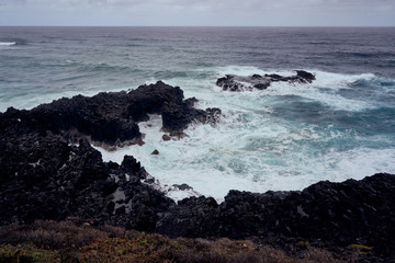 Tenerife: Black Stone Coast overlooking the rough Atlantic Sea on a rainy day