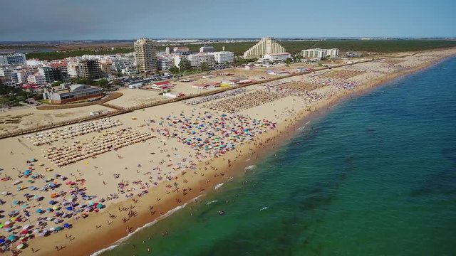 Aerial. Beautiful view from the sky of the beach and the village of Monte Gordo. Portugal