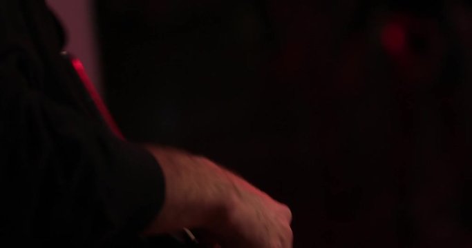 Guitar player on stage. A party, rock, playing music.