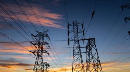 electricity pylons at sunset
