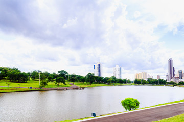Partial view of the lake in the Parque das Nações Indígenas and buildings in the background, in...