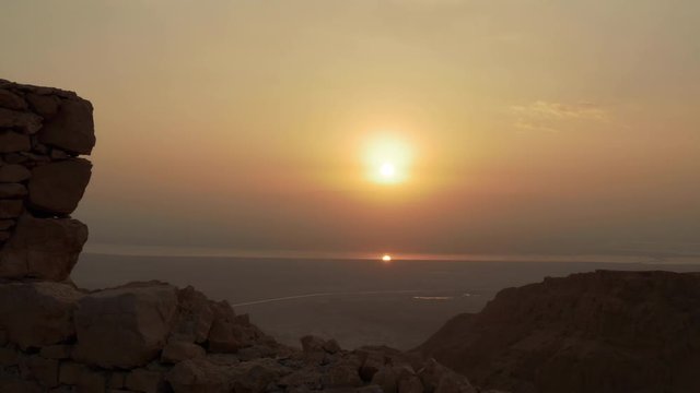 Sun reflected at dead sea water at morning sunrise
