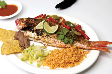 whole red snapper on a plate