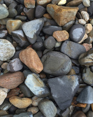 Rock and Stone Background with gray, black and brown rocks shot from a high angle