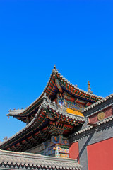 Fototapeta na wymiar Gray roof and red walls in the Five Pagoda Temple, China