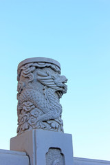 Fototapeta na wymiar White marble dragon head sculpture