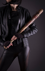 Fototapeta na wymiar Sexy female assassin with a bat