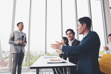 Asian Business men trainer giving presentation