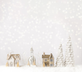 Fototapeta premium Christmas Village on a Snowy Shelf Table Christmas Decoration