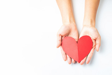 Obraz premium Hands holding red hearts / dedication love charity concept poster
