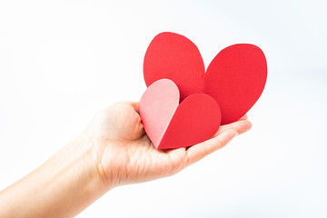 Fototapeta premium Hand holding red heart dedication love charity concept poster