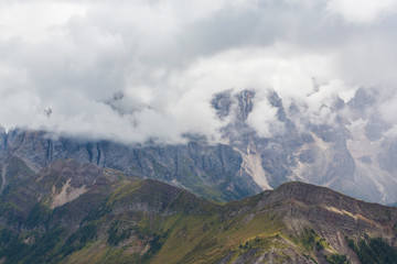 Beautiful scenery in the Dolomite Alps, with rain clouds, mist, and limestone peaks