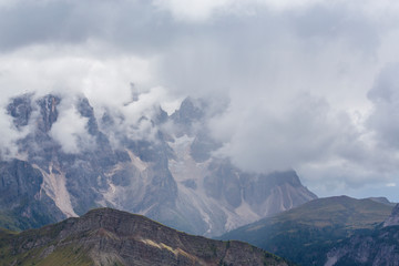 Beautiful scenery in the Dolomite Alps, with rain clouds, mist, and limestone peaks