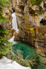 Lower Falls and turquoise pond at Johnston Canyon in Banff National Park, Alberta, Canada