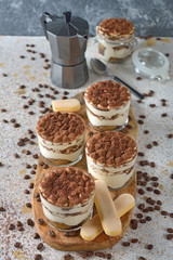 Italian dessert tiramisu on brown background
