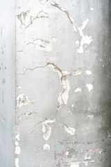 Cracked concrete wall painted with silver color texture. Perfect for background.