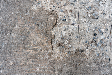 Old cracking road concrete floor texture that can see stone inside on the left side. Perfect for background.