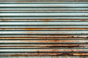 Steel rustic vintage rolling door. Rustic shutter door texture. Perfect for background.