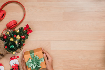 Christmas background with Xmas tree and gift boxes on wooden board,Top view with copy space.