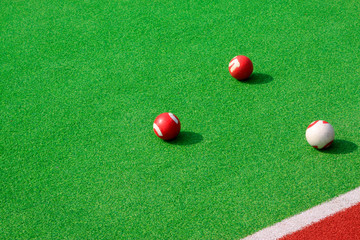 Chinese gate ball on the green plastic pitch
