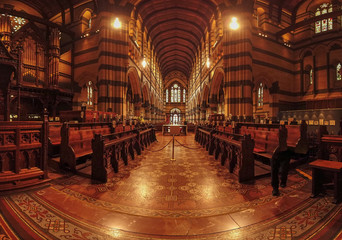 Interior of a cathedral. Looking down central aisle.