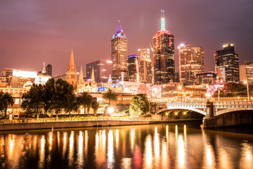 Fototapeta na wymiar Evening long exposure of the Melbourne CBD with the Yarra river in the foreground.