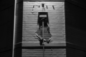 rainhead and paint peeling from a wall