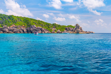 Fototapeta premium Similan Islands Beautiful tropical sandy beach and lush green foliage on a tropical island ,thailand