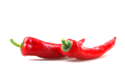 Close-Up Of Red Chili Pepper Against White Background