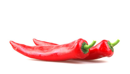 Close-Up Of Red Chili Pepper Against White Background