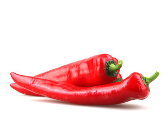 Close-Up Of Red Chili Pepper Against White Background