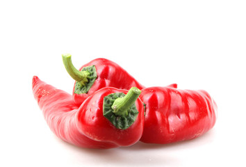 Close-Up Of Red Chili Pepper Against White Background