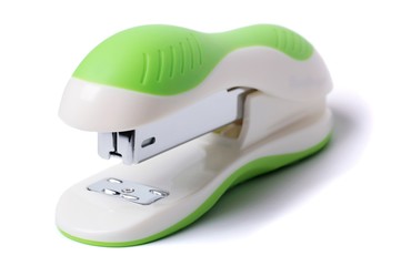 Green stapler isolated on white background