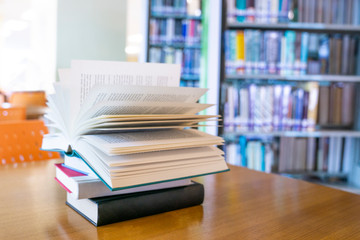 Open book on wood desk.