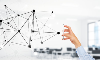 Business and technology concept with networking grid and man using device