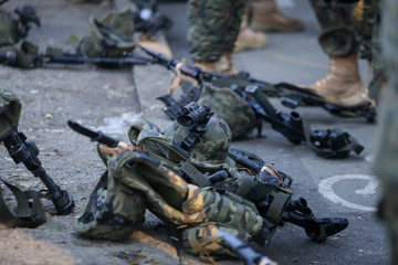 Assault rifles, army helmets with cameras and other army objects