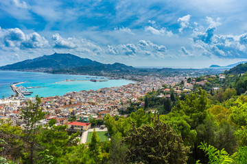 Greece, Zakynthos, Endless view over stunning mountain landscape, harbor and houses of zante town © Simon Dux Media
