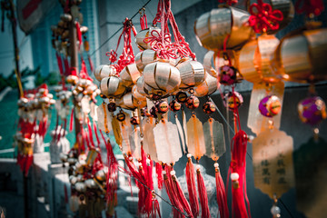 Naklejka premium Chinese kucky wishes amulets hanging on the wall in the buddhist temple of Wong Tai Sin in Hong Kong.