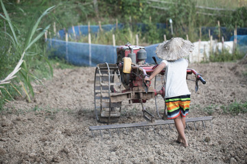 Child labor, Poor children driving a plow farming area, Children have to work because of poverty, World Day Against Child Labour concept.