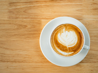 Cup of latte art coffee, top view