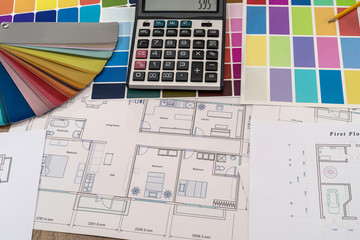 Fototapeta na wymiar House plan with color palette, calculator and brush