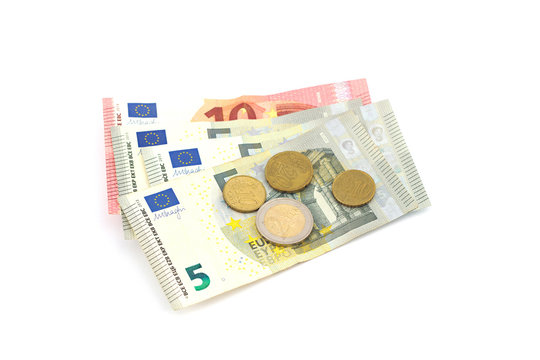 Stack of Euro banknotes and coins isolated