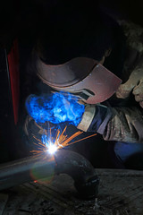 Workers welding operation
